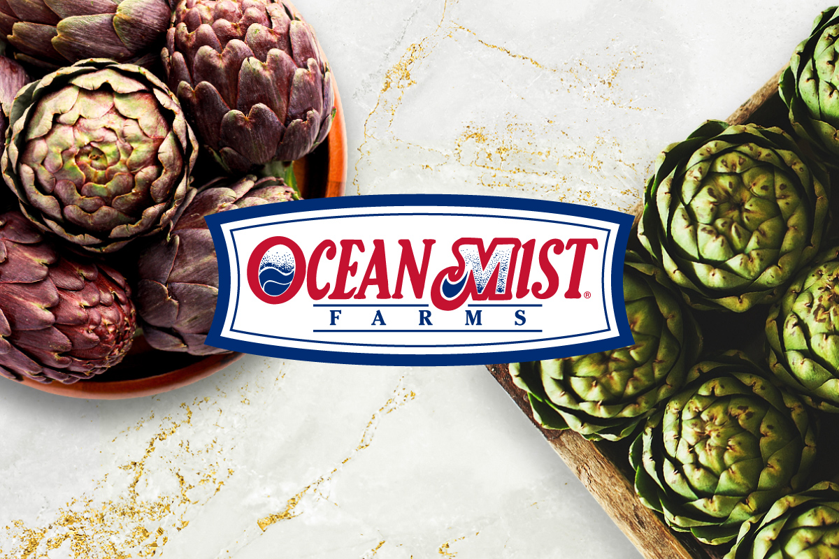 Ocean Mist Farms logo on background image of marble countertop with a box of green artichokes and a bowl of purple artichokes